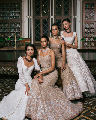 The collection weaves together global and Indian wear into a harmonious dialogue. Each piece is a celebration of technique: hand embroidery, zardozi, threadwork, appliqué, and surface ornamentation executed with obsessive detail and precision.